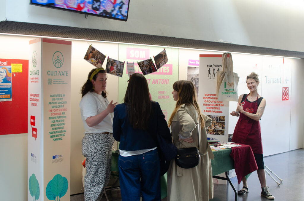 people chatting around a stand during Marketplaces